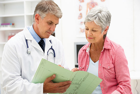 Doctor talking with patient. Link to Gifts of Cash, Checks, and Credit Cards